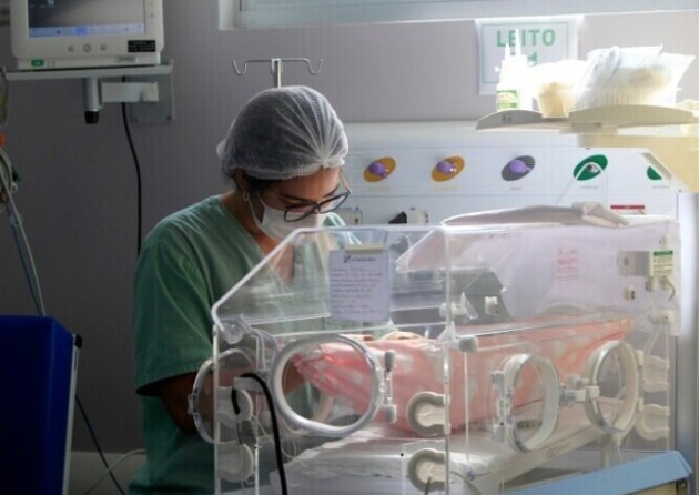 A medical professional working on a neonatal ward