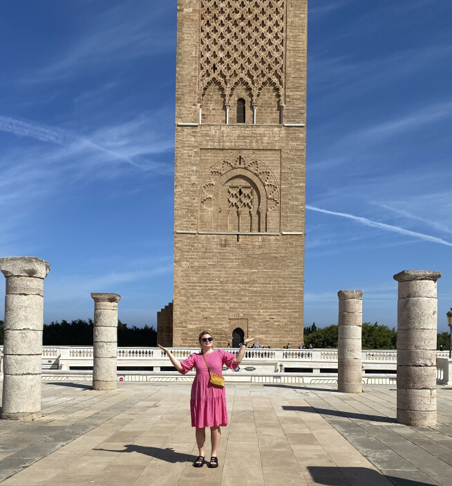 Charlotte standing in front of the Hassan Tower