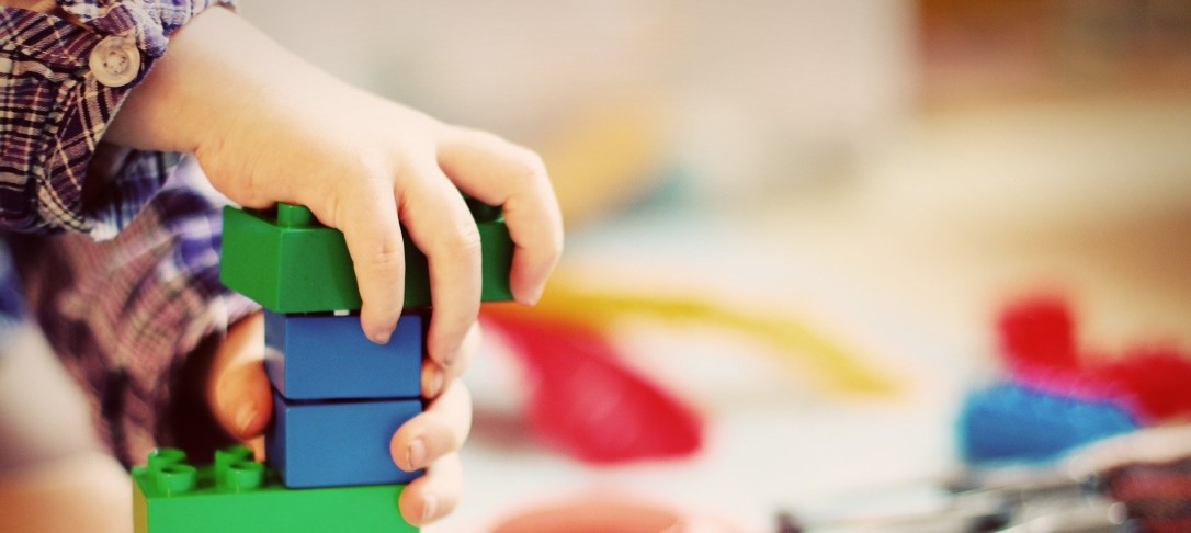 A child playing with toy bricks