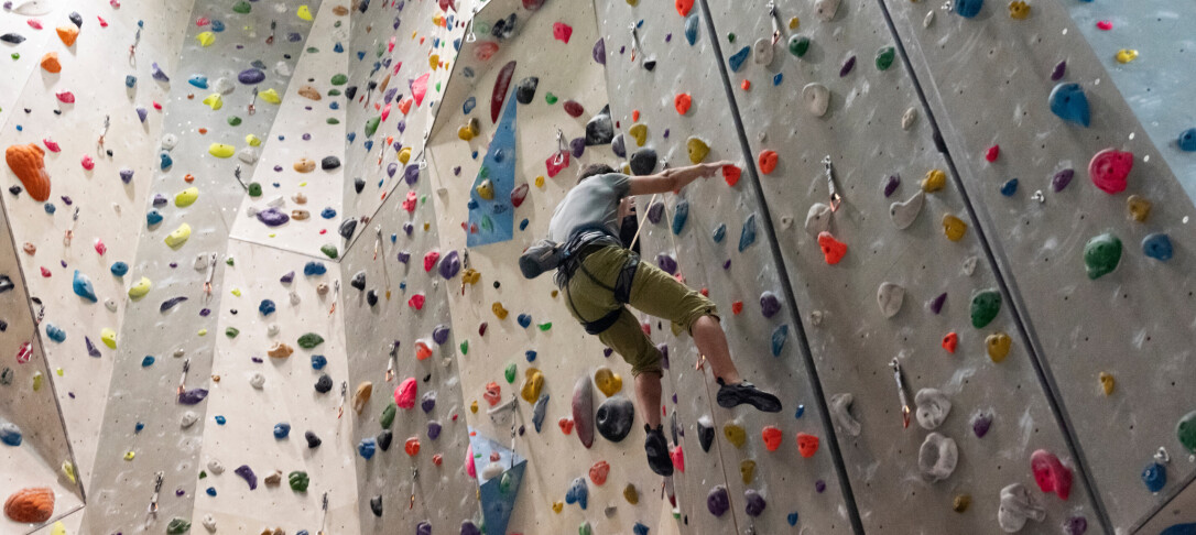 Man indoor climbing