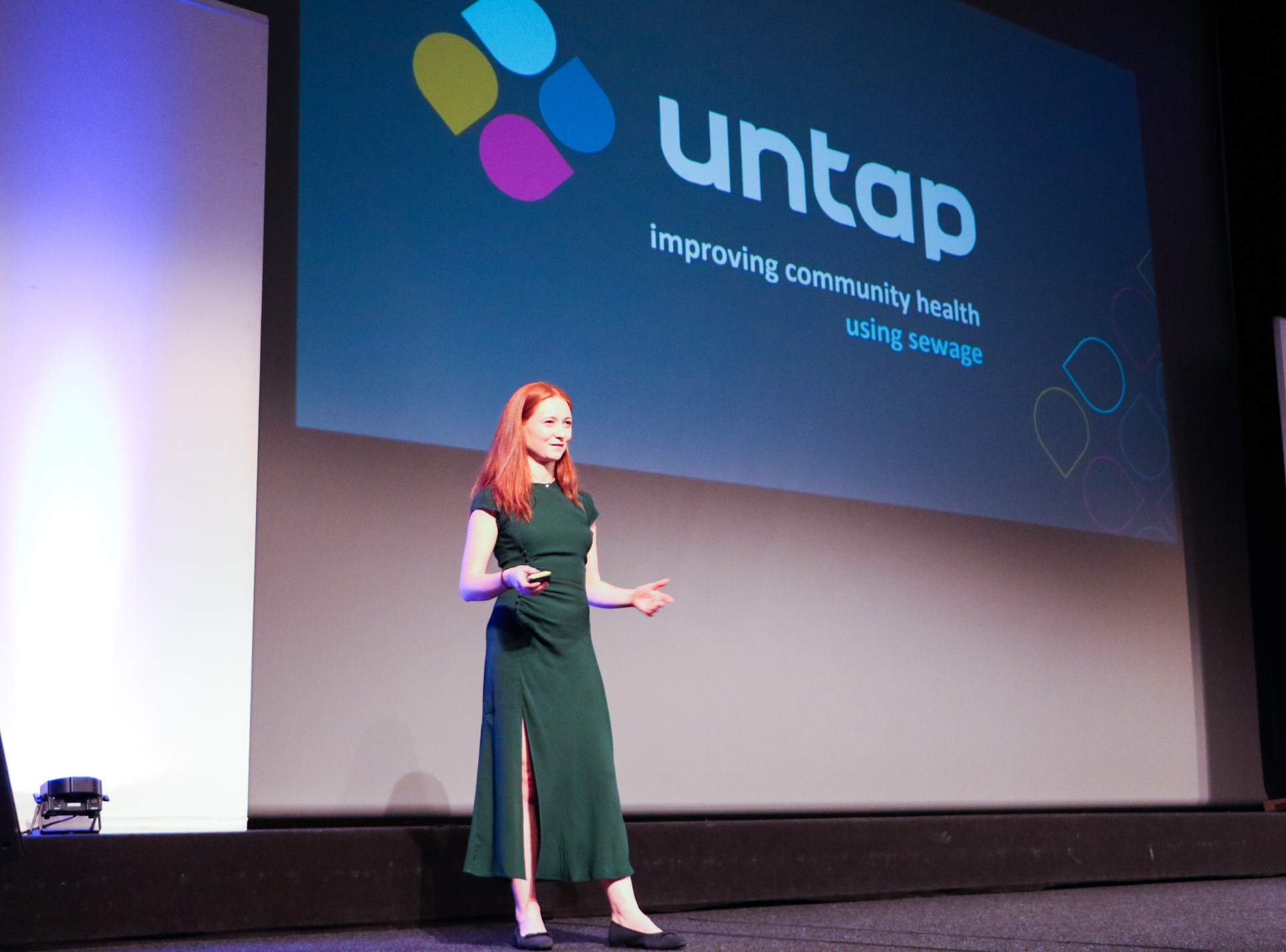 Dr Claire Trant, cofounder of Untap, presenting in front of a screen