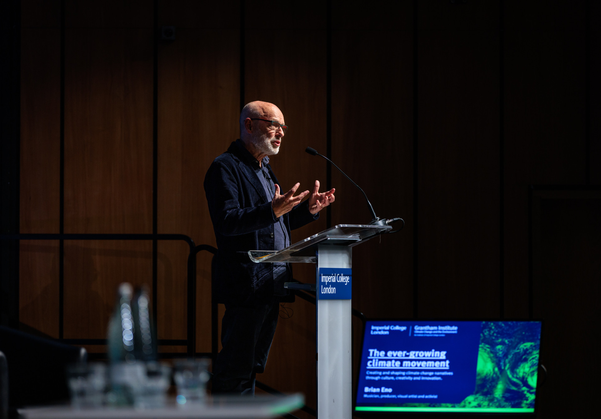  Brian Eno addresses the audience at Imperial College London, where he called for the creative industries to use their skills in story-telling and inspiring change, to help scientists better communicate the urgency of climate action.