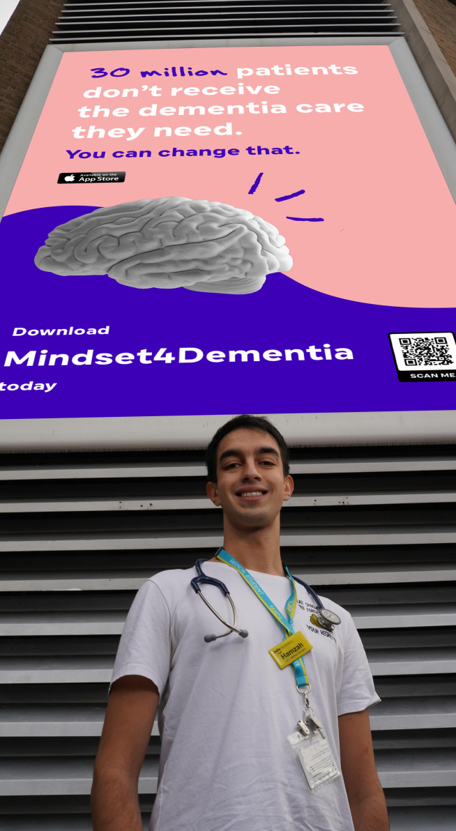 Mindset founder Hamzah in front of a recent billboard advertisement