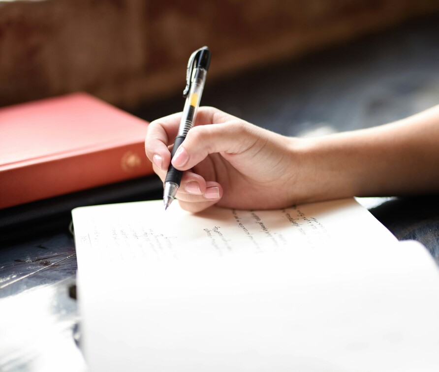 Image of a person writing