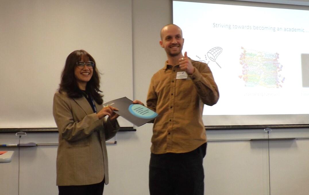 Harry Bower, MRes student, receiving his prize for Best Flash Presentation from the Royal Society of Chemistry