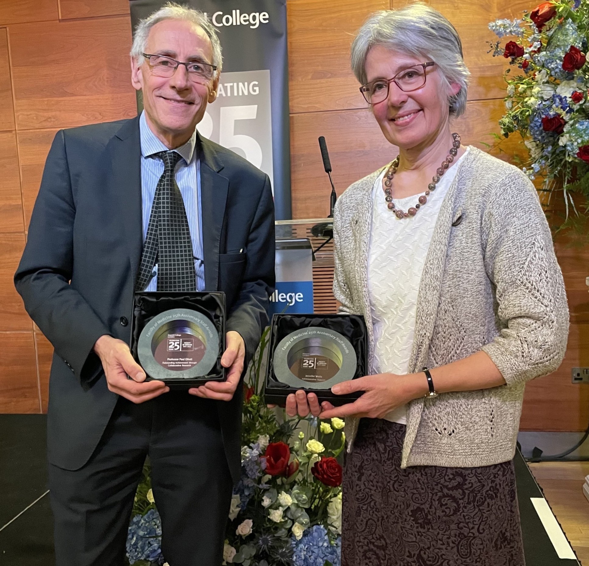 Jennifer Wells with her award alongside Professor Paul Elliott who also received an award