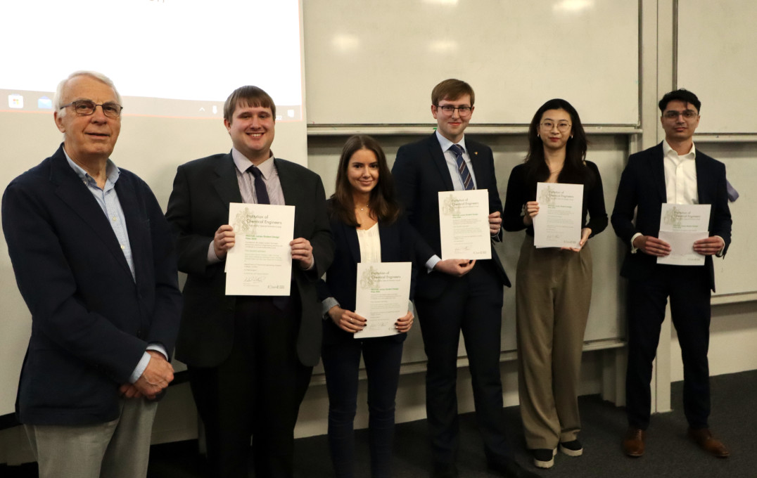 Group of students holding award certificates