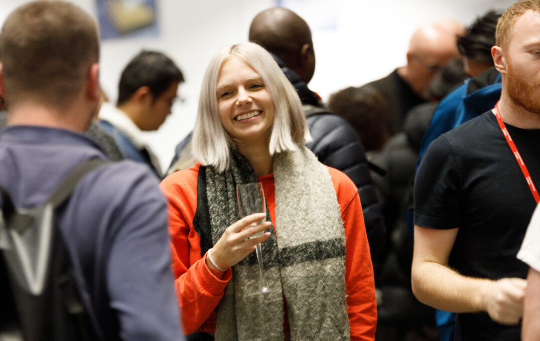 Attendees at reception smiling