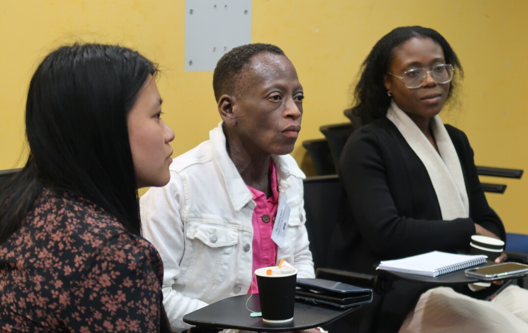 Three women sit in group