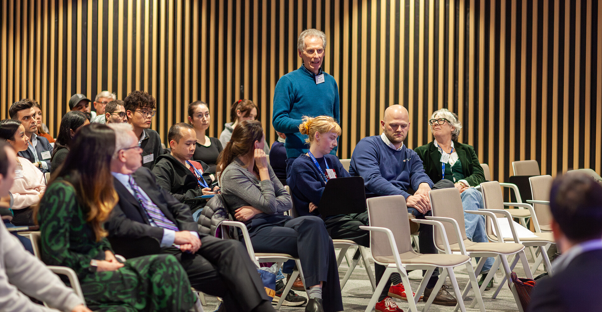 Alum asks a question of the panel