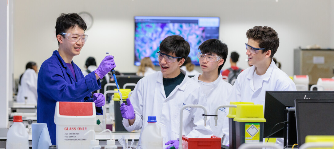 Student showing young people chemistry experiment