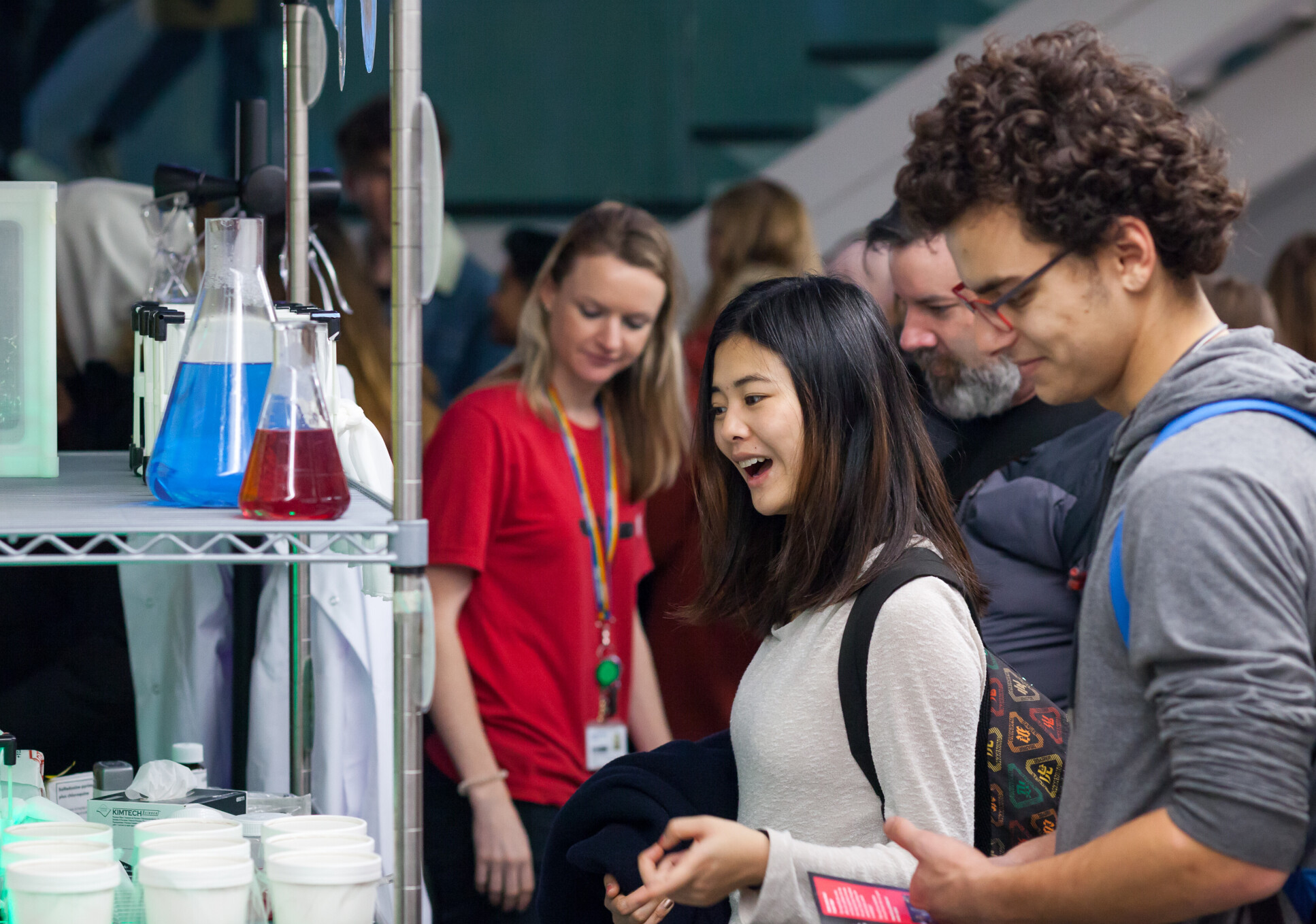 Two people looking at chemicals on a shelf