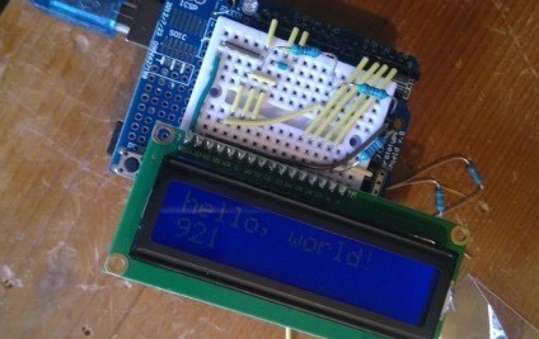 An image of the device displaying the programmed worlds 'hello world'