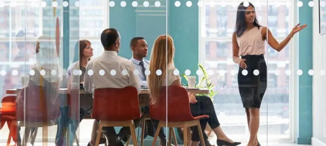 Image of a meeting taking place in an office, for MBA Information Session