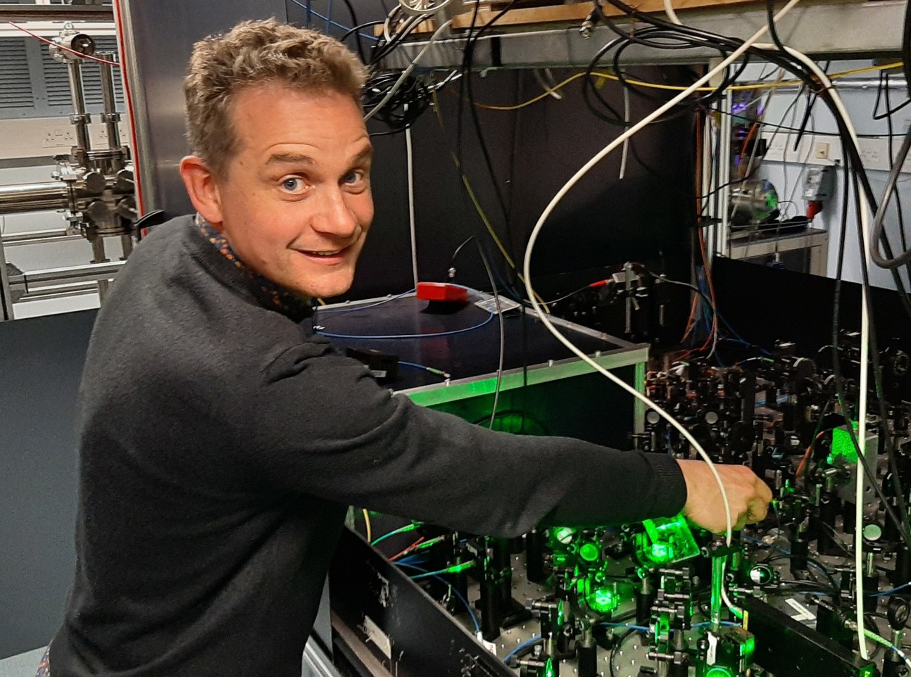 Professor Tarbutt adjusts some laser equipment
