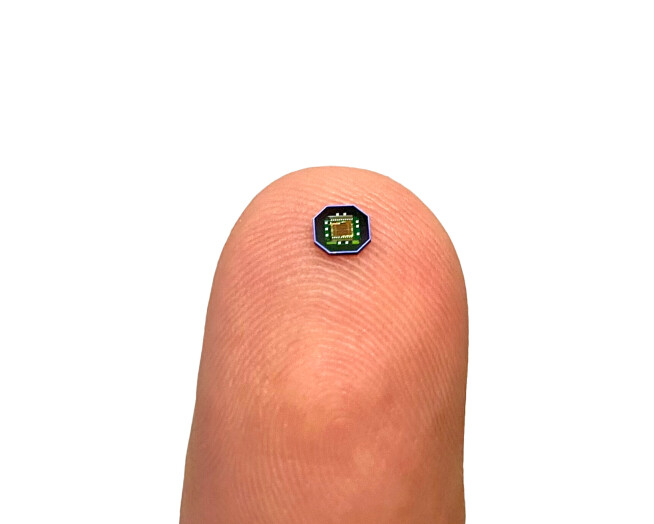 One of MintNeuro's chips shown on a human finger tip