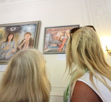 Staff viewing the portraits