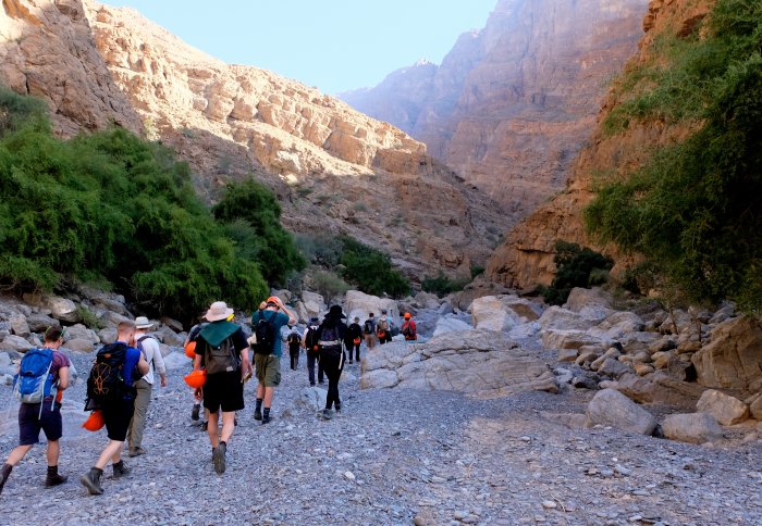 Petroleum Geoscience MSc students walk through carbonate formations in Oman
