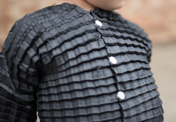An expandable shirt made for children by Imperial startup Petit Pli