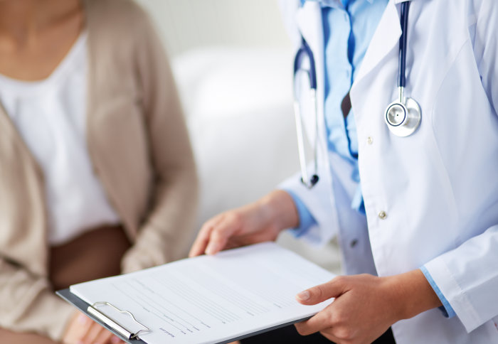 A doctor talking to a female patient