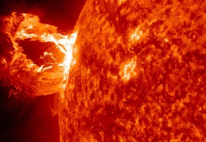 The sun with an eruption of material from the side