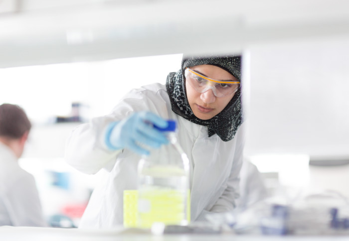 A student learns lab skills in Dr Wayne Mitchell's laboratory