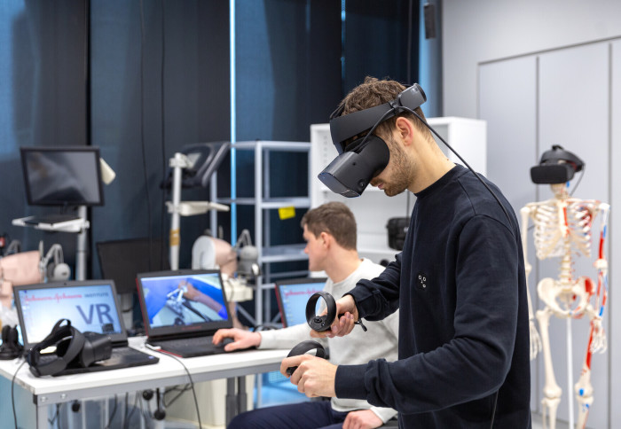 Man in virtual reality headset practises medical procedure