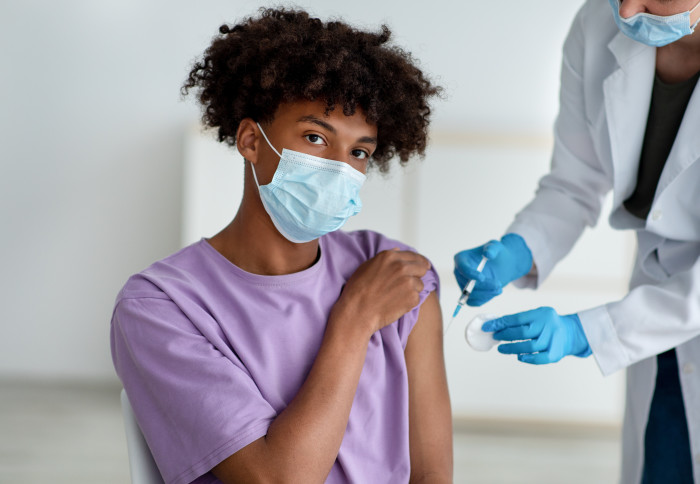 A teenager getting vaccinated