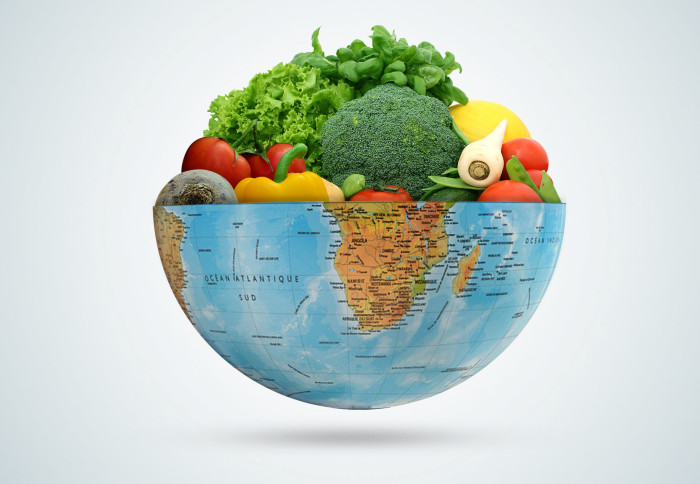 Half a globe filled with fruit and vegetables