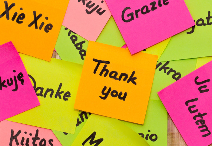 Post-it notes saying thank you in various languages