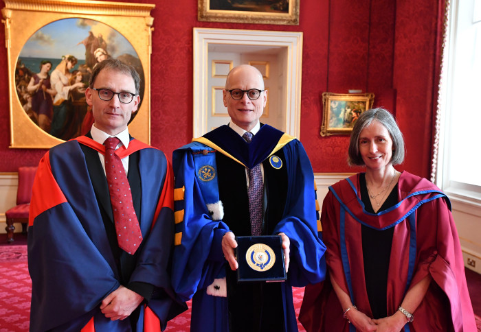 Professor Neil Ferguson, Provost Professor Ian Walmsley and Professor Emma McCoy accepting a Queen's Anniversary Prize on behalf of Imperial College London