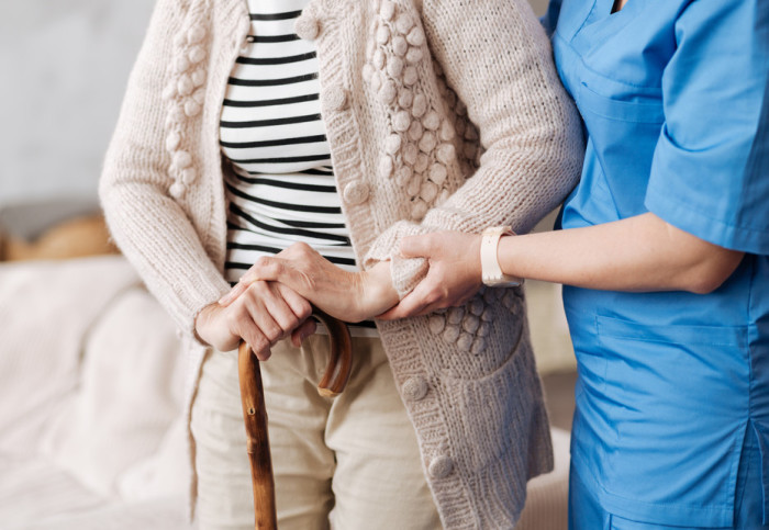 A nurse caring for an elderly patient