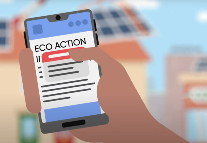 Cartoon hand holding a phone which says eco-action on it