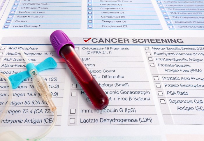 A vial of blood rests on a form for cancer screening