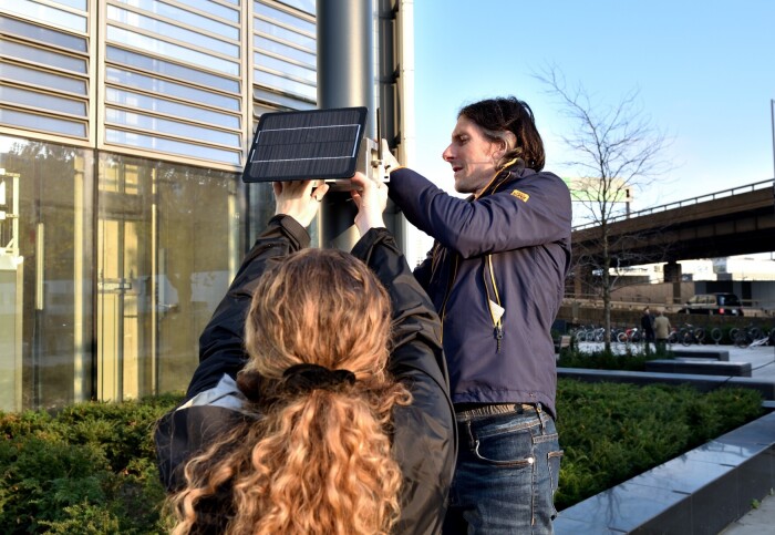Dr Kayla Schulte and Andrew Grieve, from Imperial's Environmental Research Group, installing an air quality sensor.