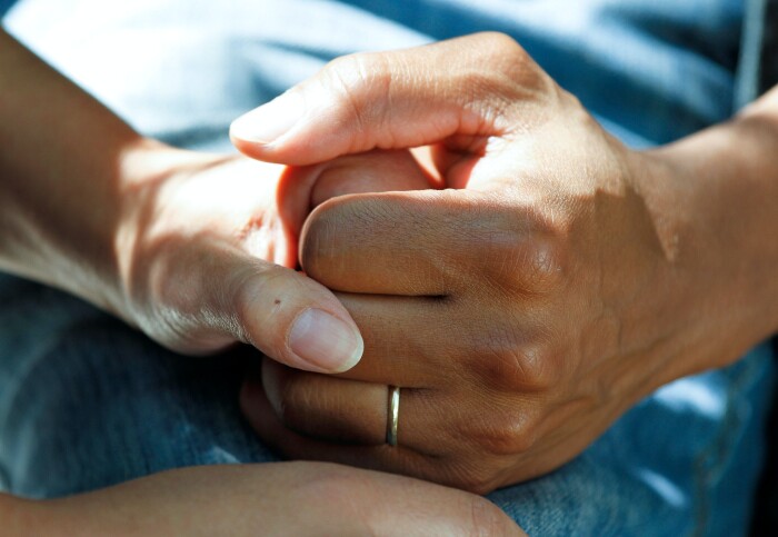 A person holding another persons hand