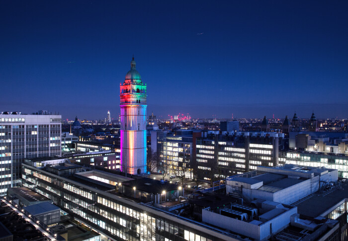 Queens Tower at night with LGBTQIA+ colours