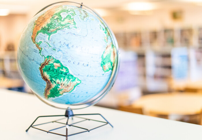 Photograph of a model globe in a library