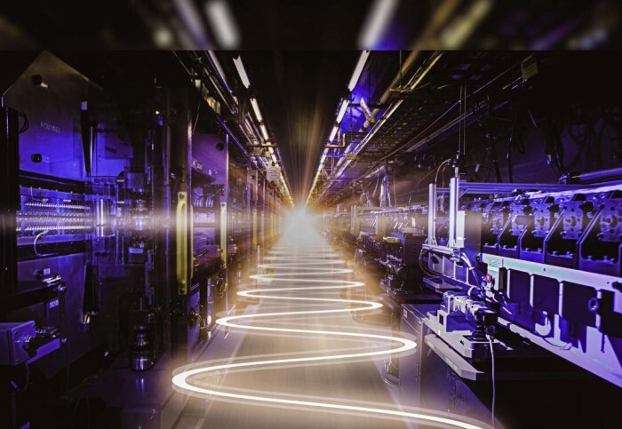 A corridor of machinery with a wavy line of light down the middle