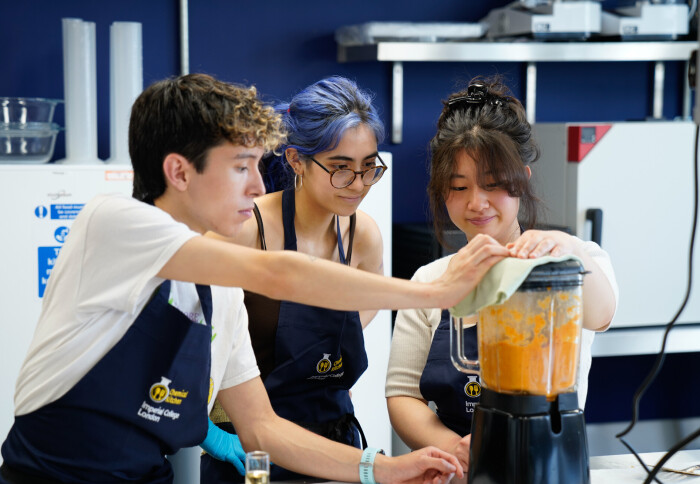 Students blending food in the kitchen