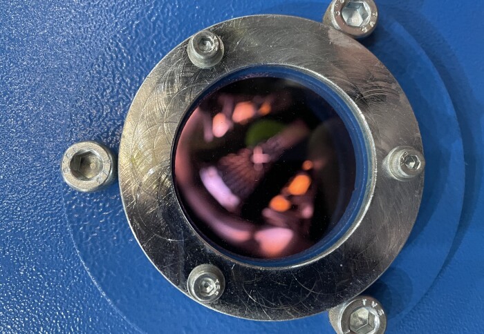 The boiler ignition flames seen through the viewing porthole