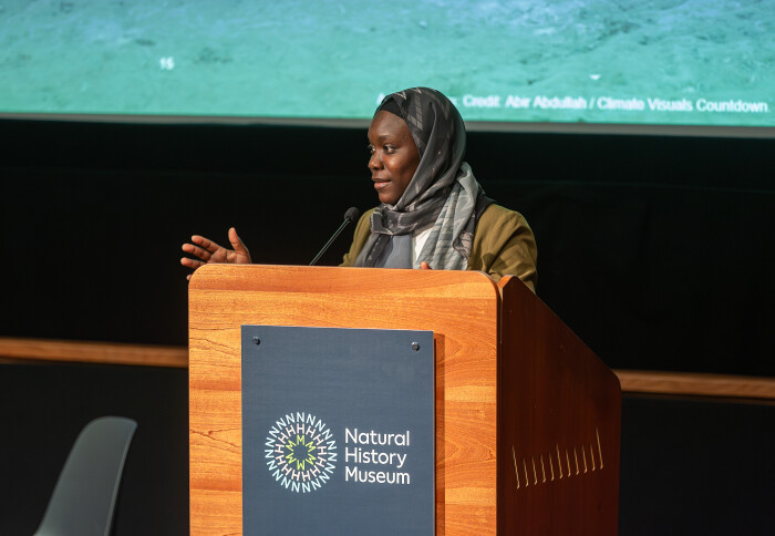 Fatou Jeng, Youth Climate Advisor to the UN Secretary General, speaking at a lectern