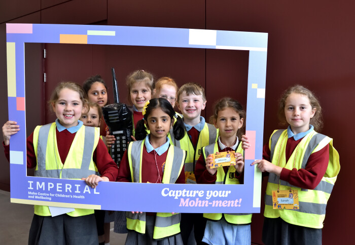 Children holding up a sign