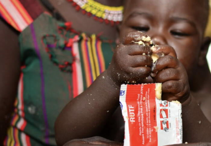 African child receiving Ready-to-Use Therapeutic Food (RUTF). Credits: Reco Industries