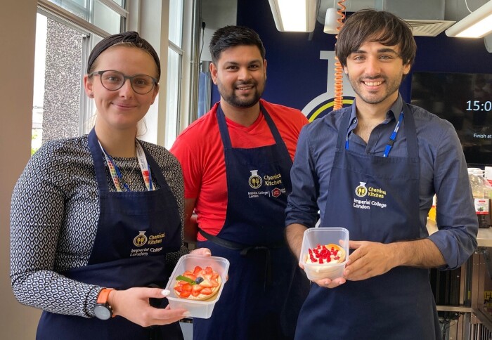 RLJ, RSi, and BFS holding cheesecakes made during the Chemical Kitchen session