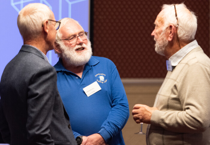 Three men chatting at Imperial Visits Nottingham Event