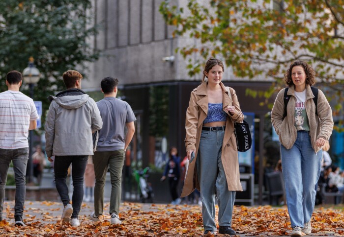 Students by the Dangoor Plaza in Autumn