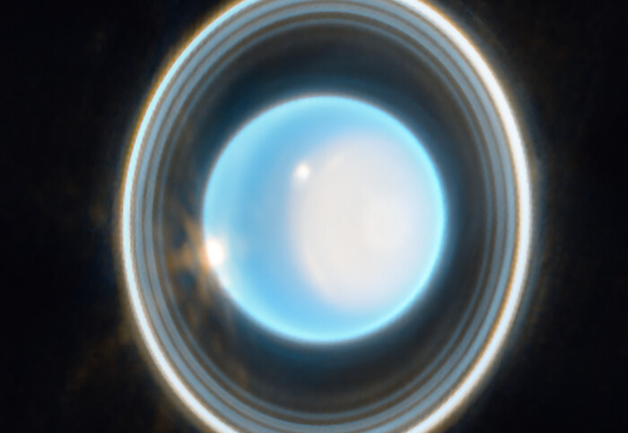 A round blue planet surrounded by rings