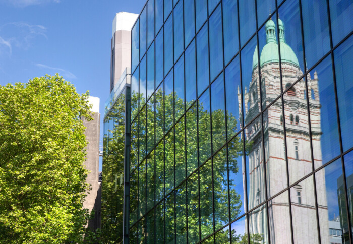 Queens tower reflection from building