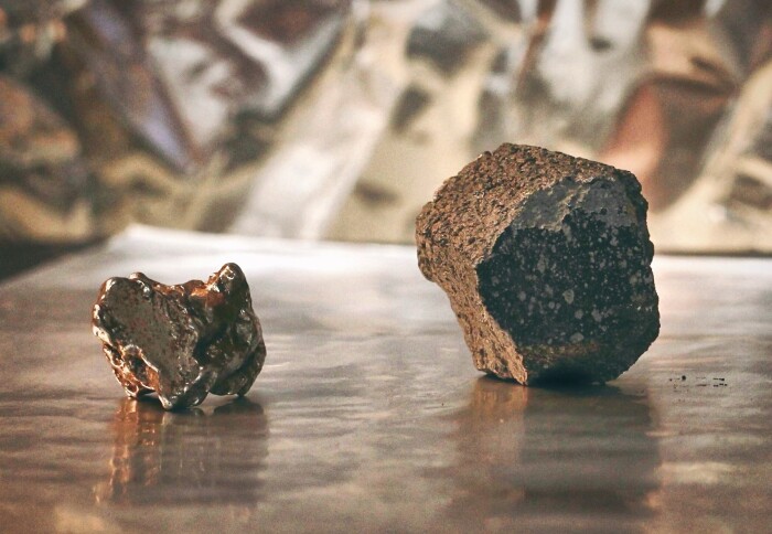 An iron meteorite from the core of a melted asteroid (left) and a chondrite meteorite, derived from a ‘primitive’, unmelted asteroid (right). Credit: Rayssa Martins and Ross Findlay